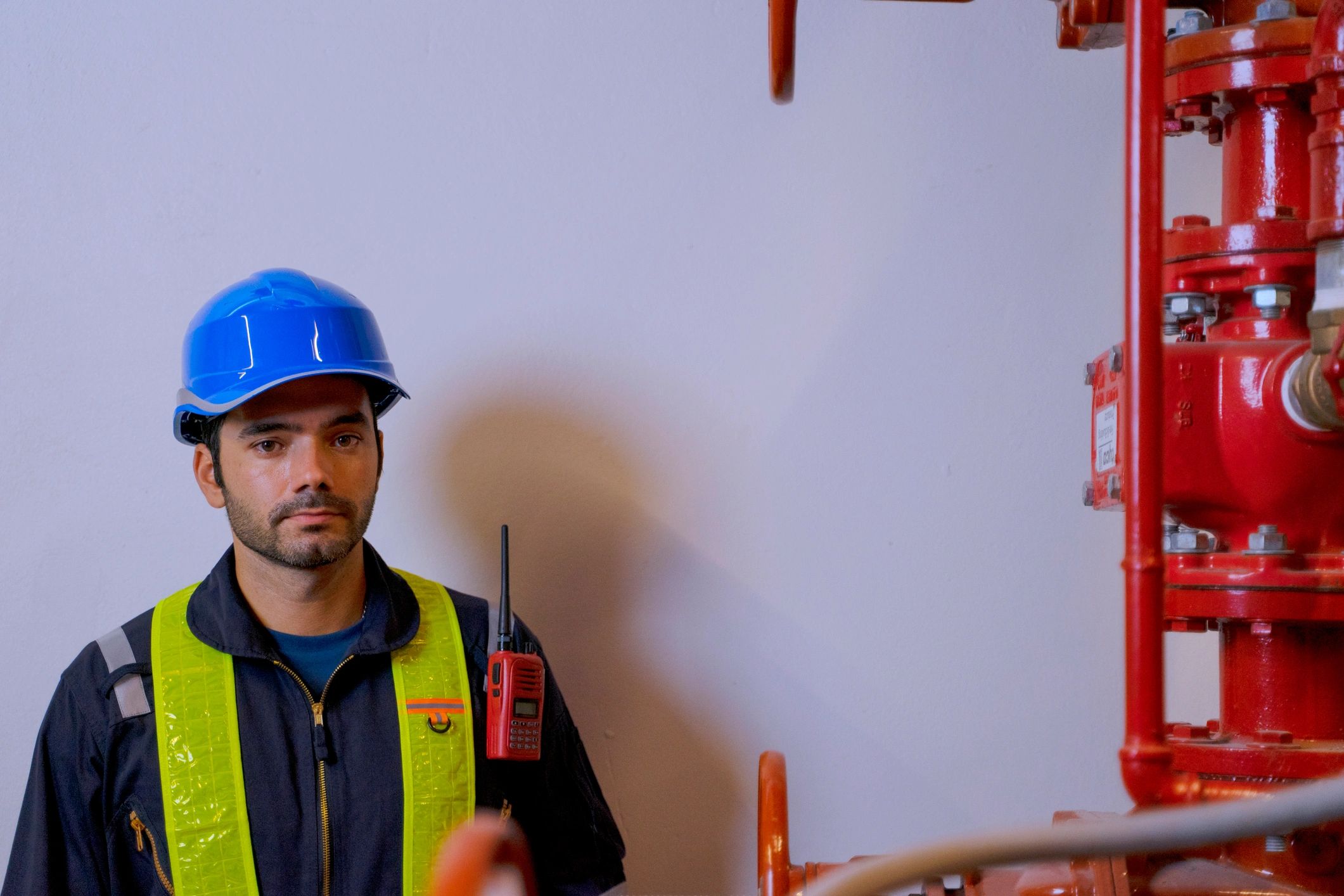 Technician working in a basement utility space