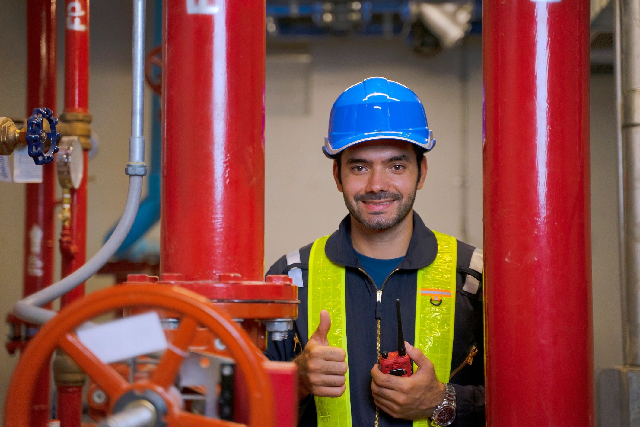 Technician working in a building utility area