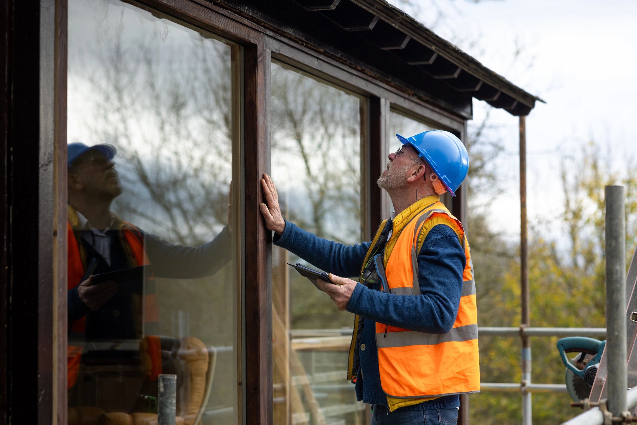 Technician inspecting plumbing-related home systems